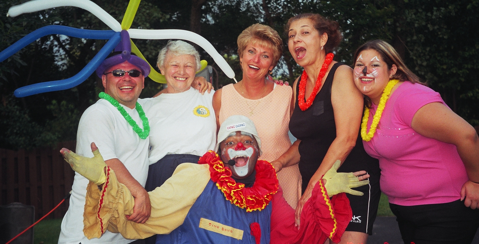 Donny in clown suit laughing with friends